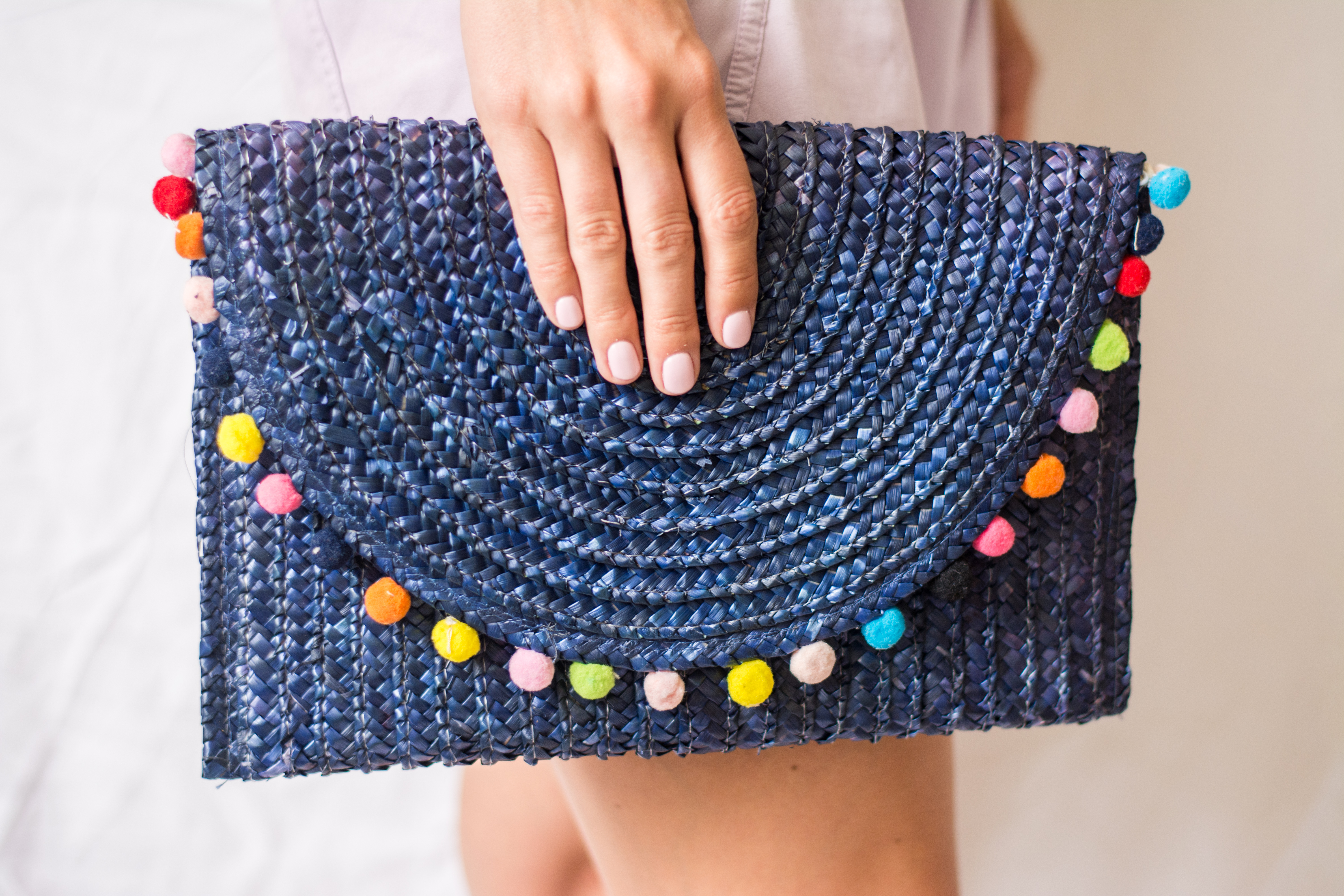 Bohemian Summer Clutch Held By Manicured Hand
